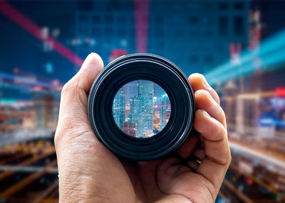 Close-up of hand holding camera
