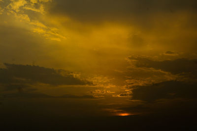 Scenic view of dramatic sky during sunset