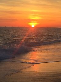 Scenic view of sea against romantic sky at sunset