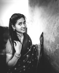 Portrait of smiling young woman outdoors