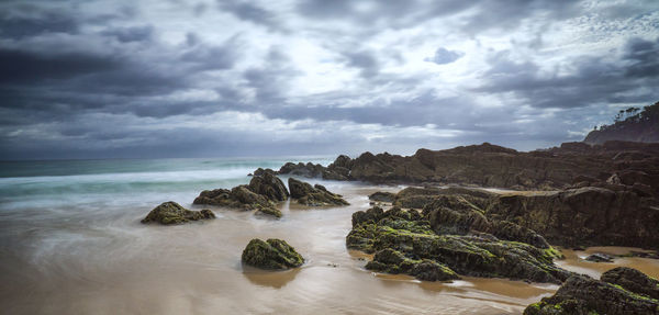 Scenic view of sea against cloudy sky