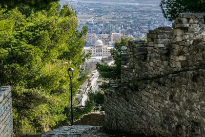 High angle view of stone wall and trees