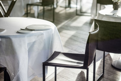 Empty chairs and table in restaurant