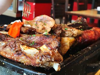 Close-up of meat on barbecue grill