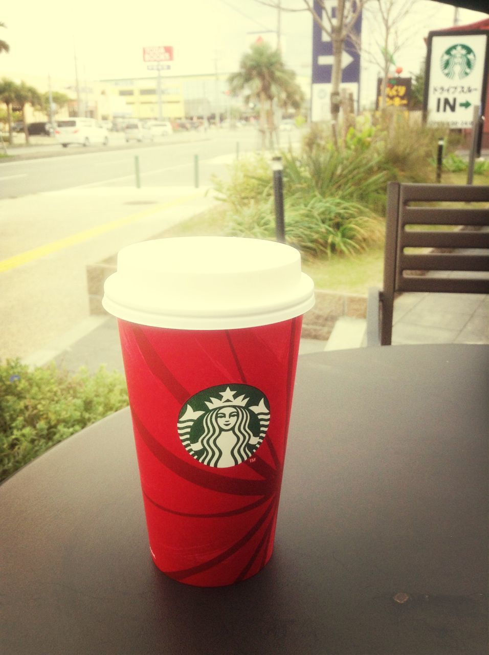 red, table, built structure, architecture, building exterior, empty, drink, day, focus on foreground, chair, outdoors, food and drink, no people, close-up, plant, tree, refreshment, freshness, street, absence