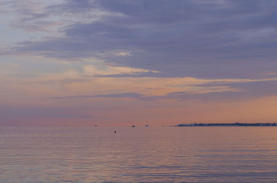 Scenic view of sea against sky at sunset