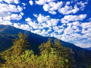 Scenic view of mountains against cloudy sky