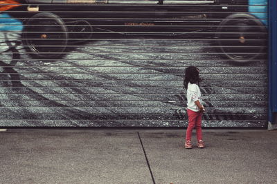 Woman standing on sidewalk