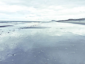 Scenic view of frozen sea against sky