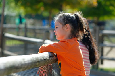 Side view of young woman looking away