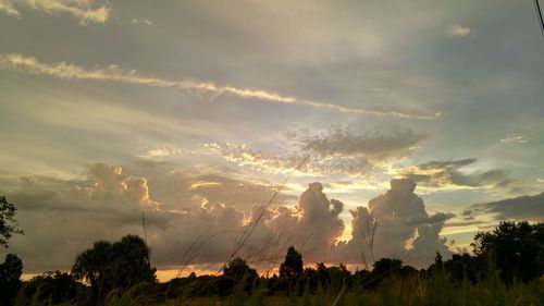 Scenic view of landscape against sky at sunset