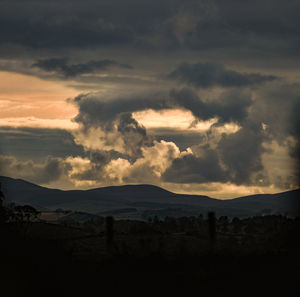 Scenic view of dramatic sky over landscape
