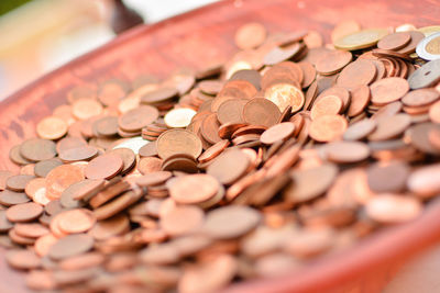 Close-up of coins in container