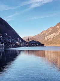 Scenic view of lake and mountains against sky