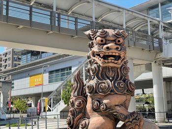 Low angle view of statue against building