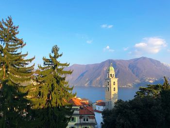 Scenic view of building and mountains against sky