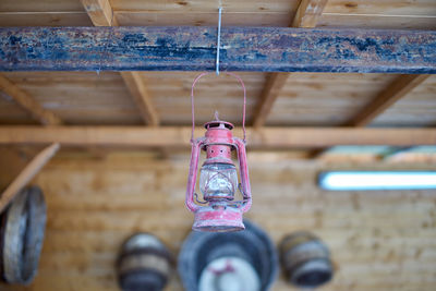 Close-up of lantern hanging from ceiling