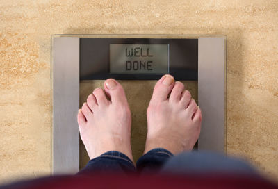 Low section of woman standing on floor