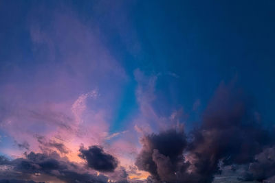 Low angle view of clouds in sky during sunset