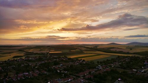 Scenic view of landscape against sky during sunset