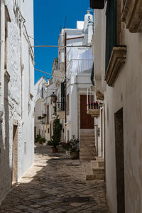 Narrow alley amidst buildings in town