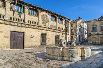 The fountain is adorned with the statues of lions and oxen, baeza, spain