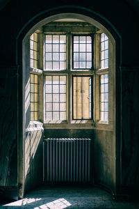 Beautiful old window with heat radiator beneath it