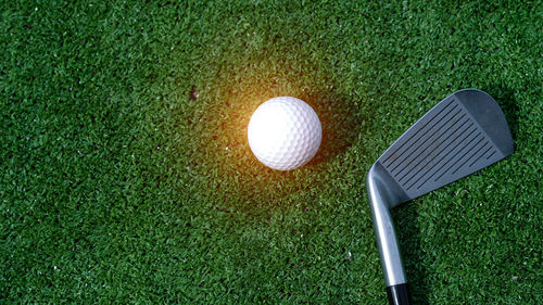 High angle view of golf ball on grass