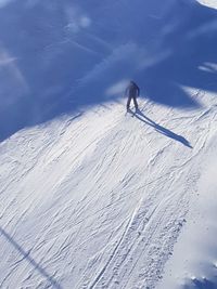 Person skiing on snowcapped mountain