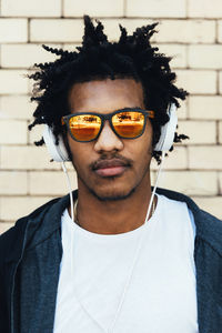 Portrait of young man standing outdoors