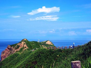 Scenic view of sea against cloudy sky