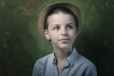 Portrait of young woman wearing hat