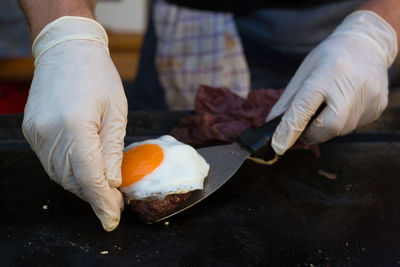 Midsection of man preparing food