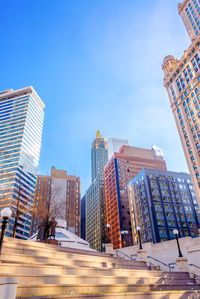 Low angle view of modern buildings against clear sky in city