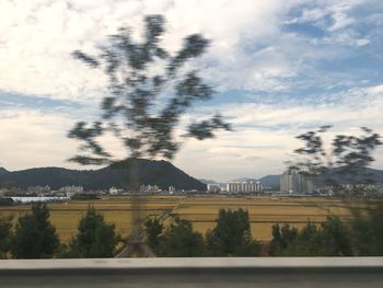 Scenic view of mountains against cloudy sky