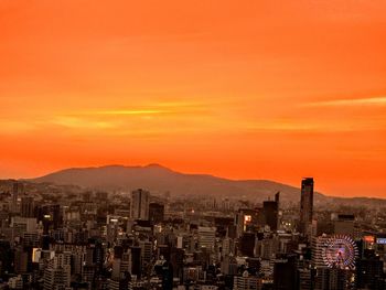 High angle view of city at sunset