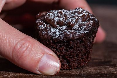 Close-up of hand holding ice cream
