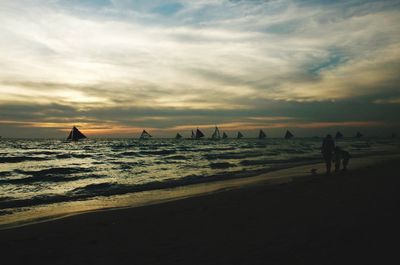 Scenic view of sea against cloudy sky