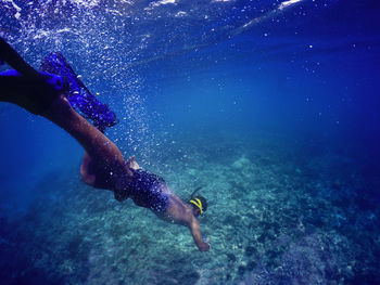 Woman swimming in sea