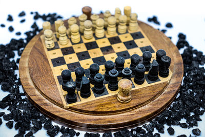 High angle view of chess pieces on table