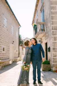 Full length of couple on road 