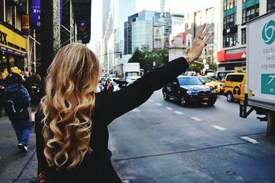 Woman standing on city street