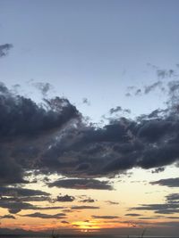 Low angle view of dramatic sky during sunset