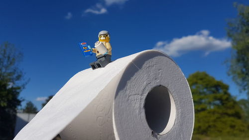 Low angle view of statue against blue sky