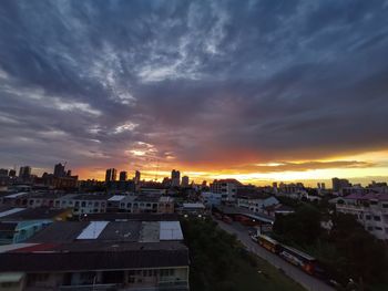 High angle view of buildings against sky during sunset