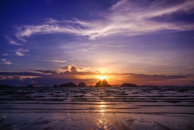 Scenic view of beach against sky during sunset