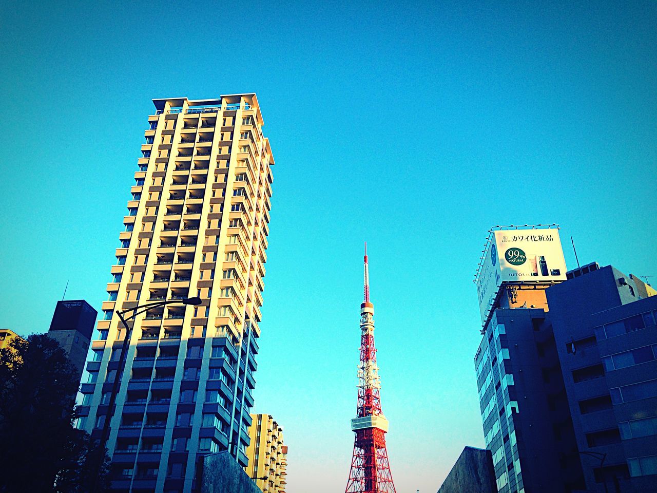 architecture, low angle view, building exterior, built structure, clear sky, tall - high, tower, blue, skyscraper, city, modern, office building, copy space, tall, capital cities, building, development, day, outdoors, travel destinations