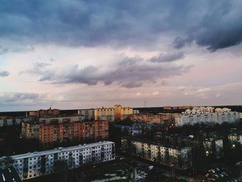 High angle view of buildings against sky at sunset