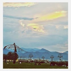 Landscape with mountains against cloudy sky