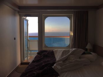 Scenic view of sea against sky seen through home window